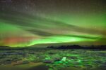 Island - Polarlichter über Gletschereislagune Jökulsarlon